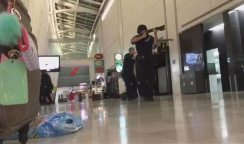 Gunman opens fire in front of passengers at New York’s JFK Airport, sparking panic