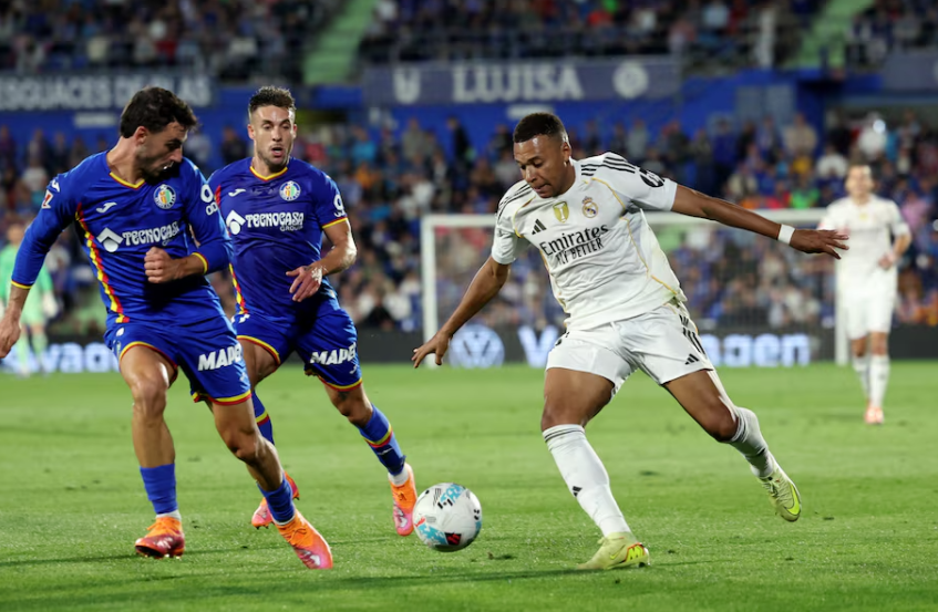 Mbappe scores again to send Real top