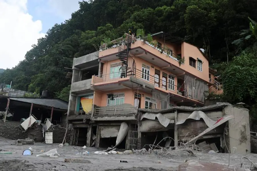 Lake Threat Eases, Nepal and China Resume Search for Flood Survivors