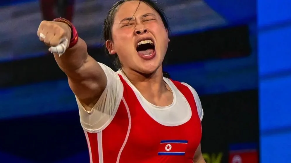 North Korean athlete breaks three world records in a single event.