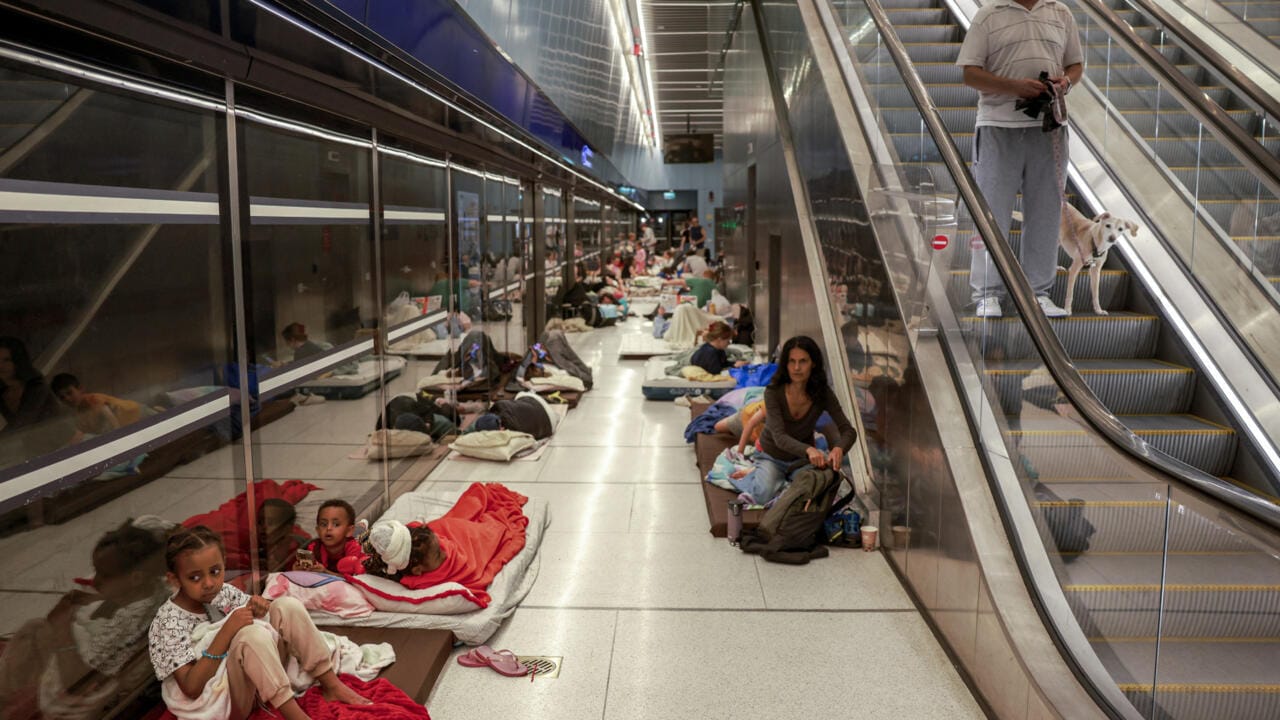 With missiles overhead, Tel Aviv residents huddle underground