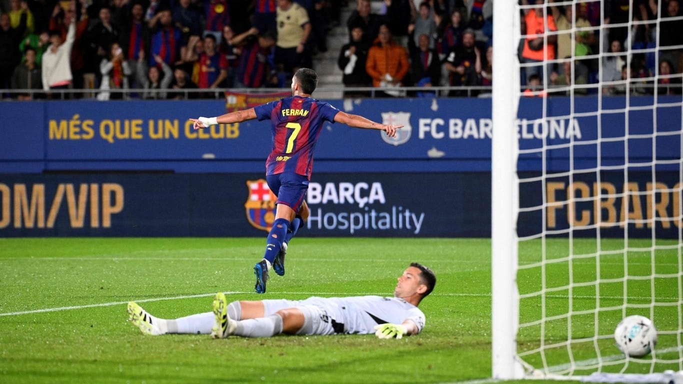Torres double helps Barca down listless Getafe