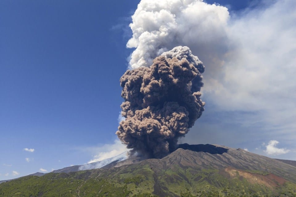 Sicily's Mount Etna erupts with columns of smoke and ash